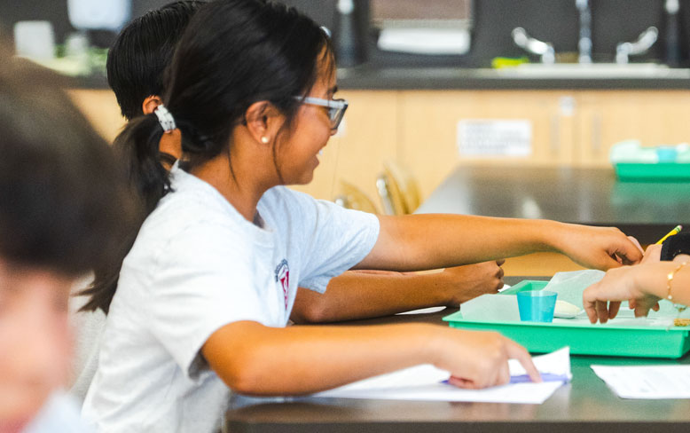 YOUNG GIRL IN CLASS