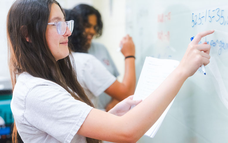 Student in the classroom at the blackboard