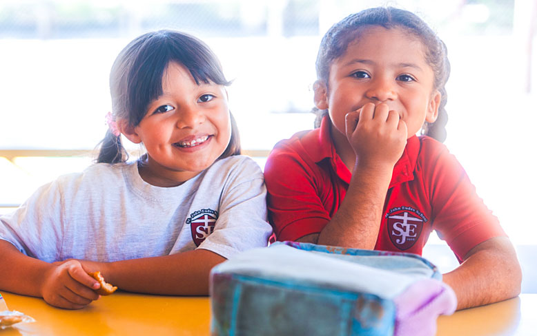 Two young school kids