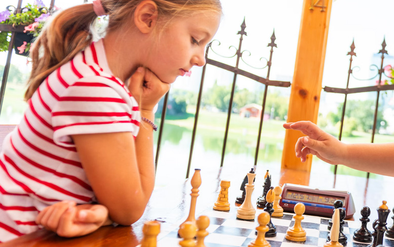 sje-chess-club-all-grades Girl playing chess